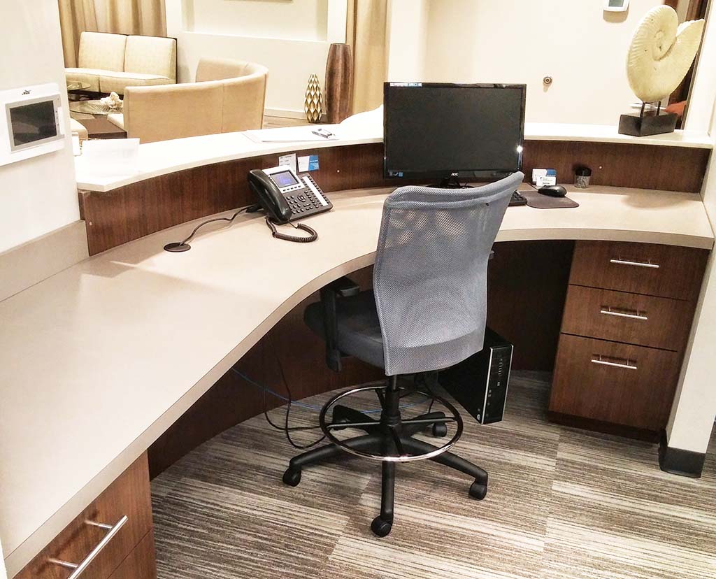 Custom healthcare radius desk by HMC Custom Cabinets